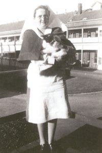 [Alt image text: Amy photographed with Buttons her beloved cat. Amy left a bequest gift in her Will to care for cats and dogs after she had passed away.]